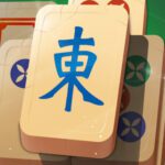 Image of a classic Mahjong tile with Chinese characters and symbols.