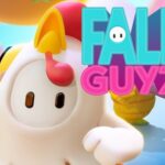 Image of a bean-shaped character wearing a white chicken costume with a red comb, set against a colorful background featuring the bright pink and teal “Fall Guyz” logo.