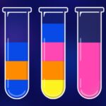 Image of three glass test tubes filled with different colored liquids. The first tube contains blue and orange, the second tube contains blue, pink, and yellow, and the third tube contains pink and black.