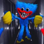 Image of Huggy Wuggy - unblocked game, the terrifying blue creature from the horror game Poppy Playtime, with a wide, menacing grin, outstretched arms, and mismatched hands in a dimly lit hallway.