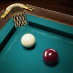 Image of a strategic face-off: a white and bordeaux ball poised near a pocket in The Best Russian Billiards game.
