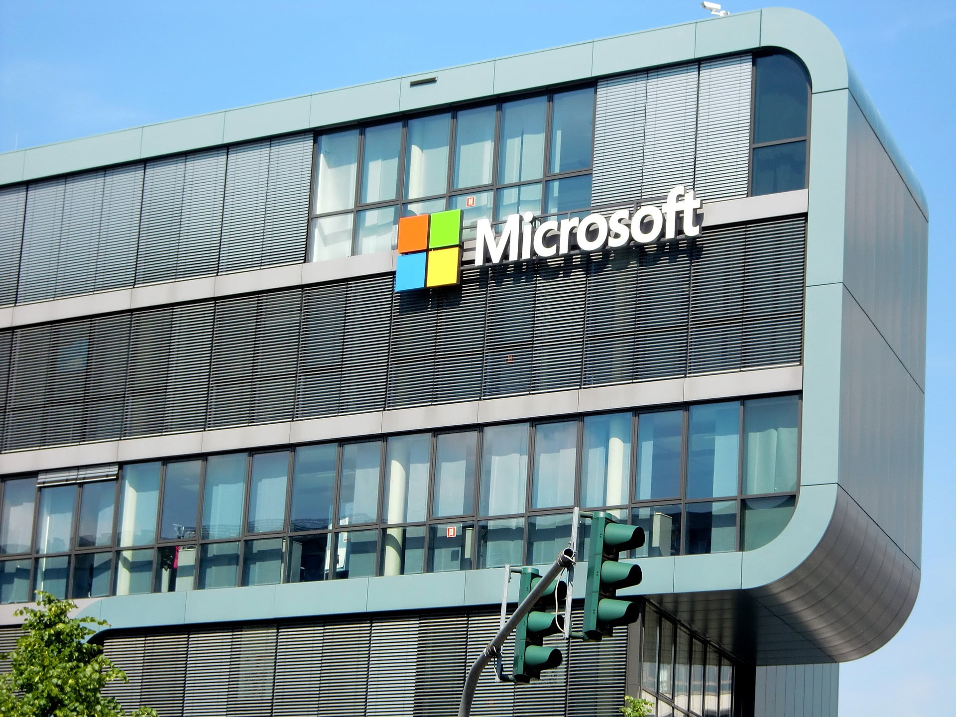 Image of a monumental Microsoft headquarters adorned with the iconic company sign, symbolizing the historic $68.7 Billion acquisition of Activision Blizzard—an epochal shift in the gaming industry landscape. The imposing structure stands as a visual testament to the transformative moment that reshapes the future of gaming under Microsoft's formidable influence.
