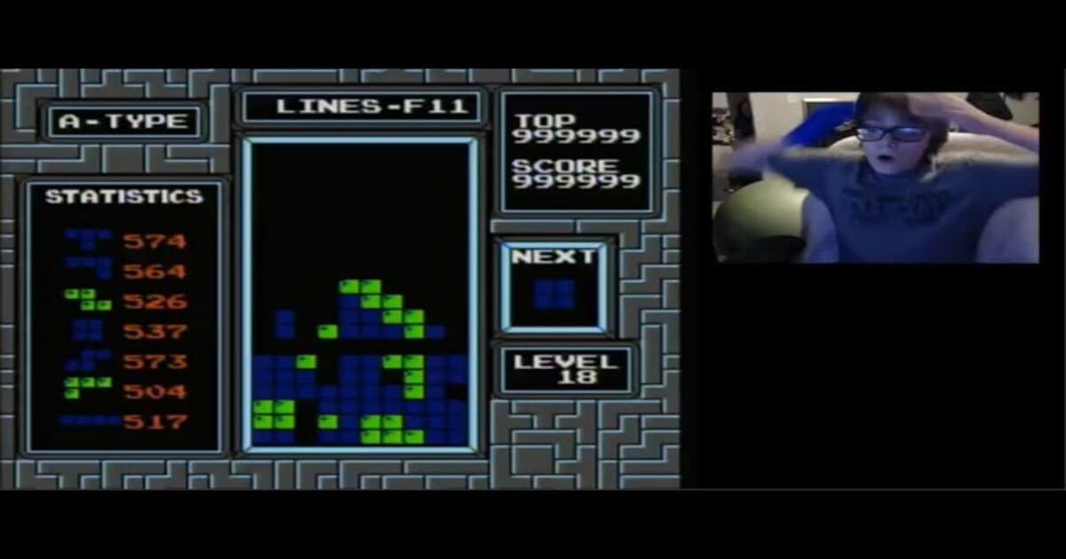 An excited 13-year-old boy celebrates after achieving the impossible - beating the infamous "kill screen" on the NES Tetris game.