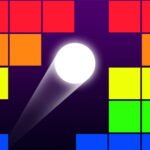 Image of a classic brick breaker game in progress. A white ball is in motion, bouncing off a paddle at the bottom of the screen and striking a row of colorful bricks arranged at the top. The bricks are various shades of red, orange, yellow, green, and blue. The background is a dark purple color.