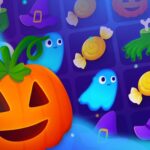 Image of a Halloween-themed match-3 game with a pumpkin, ghosts, candies, and hats on a colorful grid.